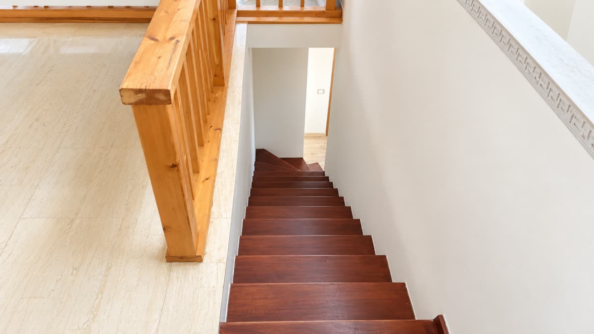 Internal wooden staircase between the two levels.
