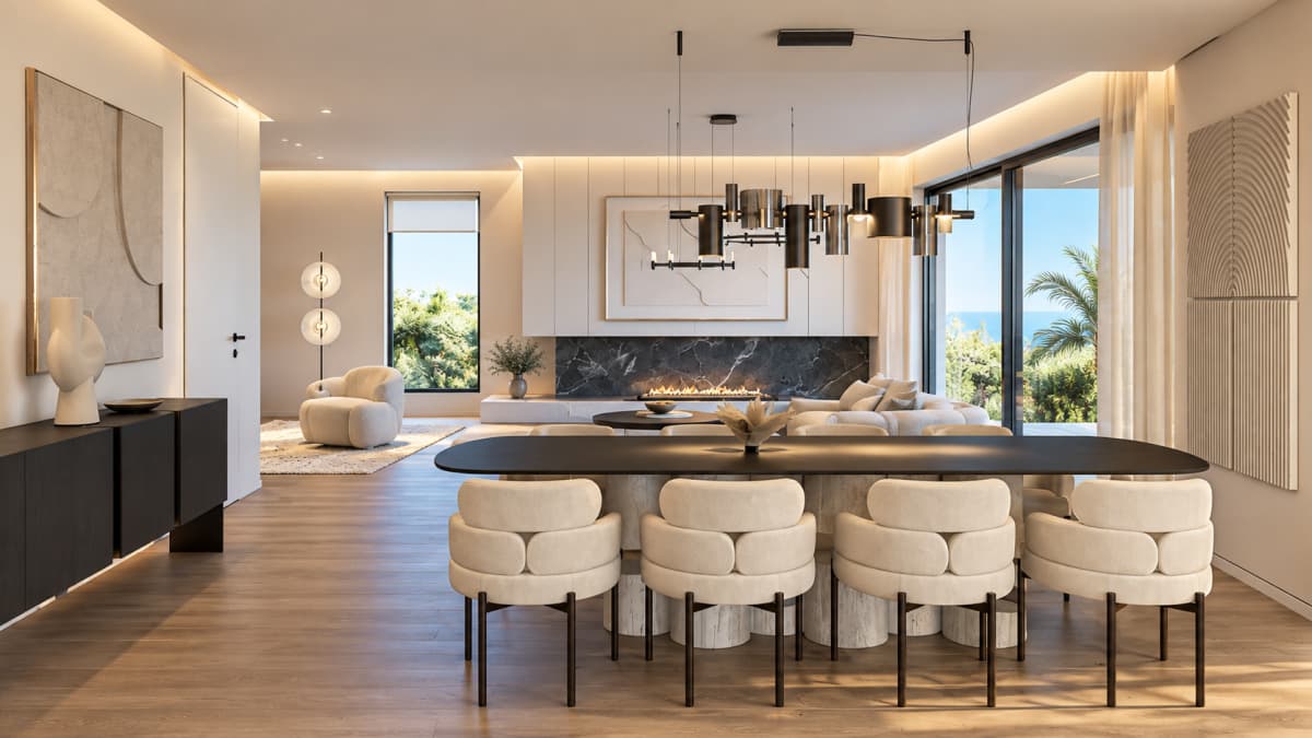 A brightly lit living and dining area features a dark dining table with upholstered beige chairs, a modern black and white fireplace set against a black marble wall, and large sliding glass doors revealing an outdoor view with palm trees.