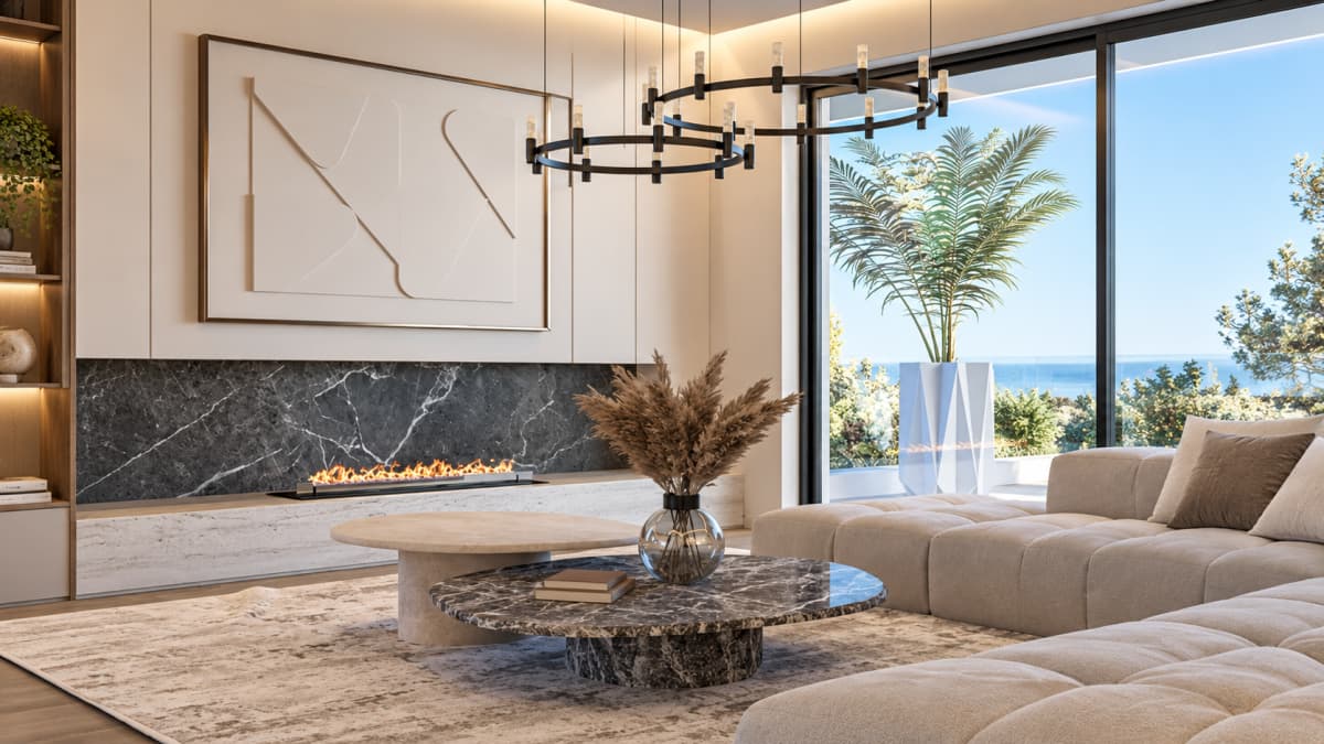 A modern living room with a linear fireplace, a marble accent wall, coffee tables, a sectional sofa, and a sea view.