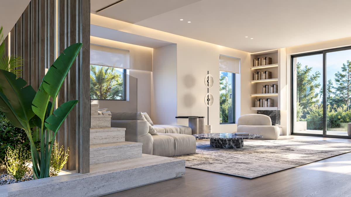 A modern living room featuring a low light-colored sofa, a round marble coffee table, a built-in bookshelf, and large glass sliding doors looking out onto greenery.