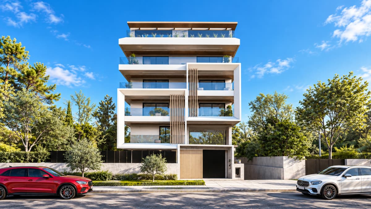 Front exterior of a modern multi-story apartment building with balconies, parked cars, and trees under a clear sky.