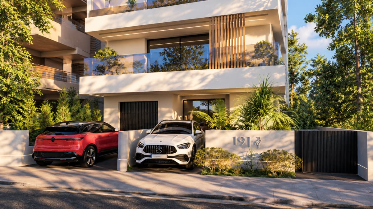 Exterior view of a modern multi-story residential building with balconies, vertical wooden slats, and two parked cars.