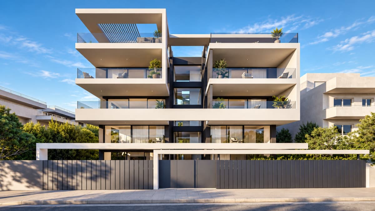 A modern multi-story apartment building with white balconies and large glass windows stands behind a gray vertical-slat fence and gated entrance.