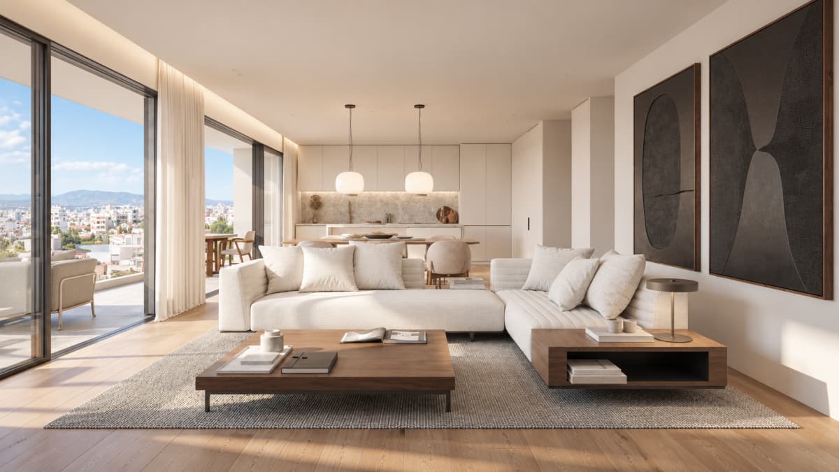 A modern living room features a white sectional sofa, a dark wooden coffee table, and large abstract art pieces on the wall.